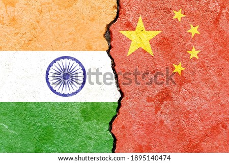 India VS China national flags on broken concrete wall background, abstract India China international political conflicts concept
