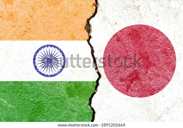 India VS Japan national flags icon isolated on\
broken weathered cracked concrete wall background, abstract\
international political relationship friendship conflicts concept\
texture wallpaper