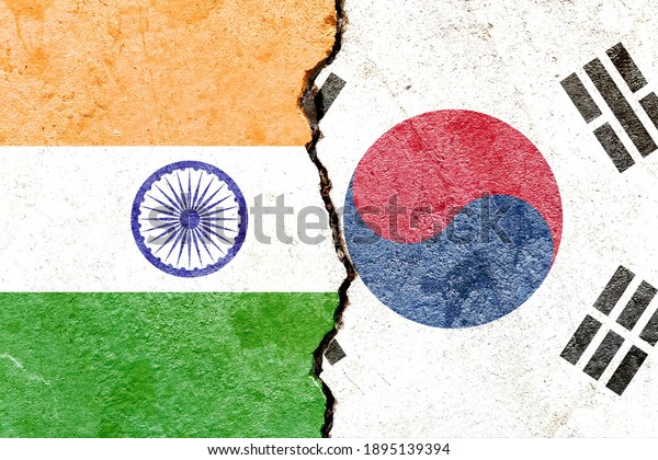India VS South Korea national flags icon
isolated on broken weathered cracked concrete wall background,
abstract international political relationship friendship conflicts
concept texture wallpaper
