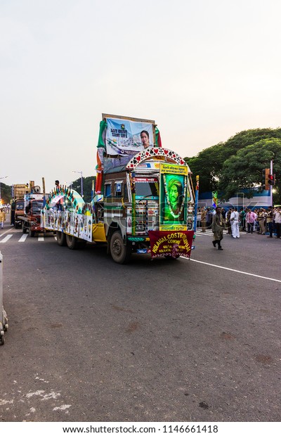 India, West Bengal, Kolkata - 10.14.2016 -\
Lorries and trucks decorated with festoons and banners at the durga\
puja carnival.