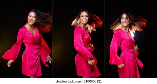 Indian Asian 20s Tanned Skin Woman Wear Pink Shinny Dress Express Feeling Happy Smile. Fashion Female Poses Spin Throw Hair In Air With Back Light Backlit Half Body Over Gray Dark Background Isolated