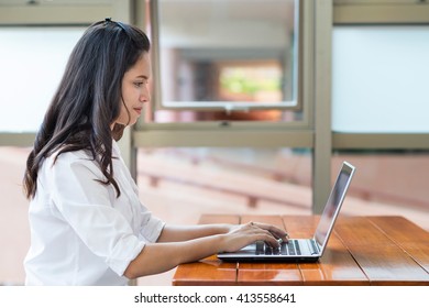 Indian / Asian College Student Working With Laptop Computer.