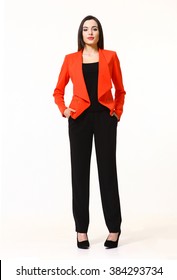 Indian Asian Eastern Brunette Business Executive Woman With Updo Hair Style In Red Jacket And Black Trousers High Heels Shoes Full Length Body Portrait Standing Isolated On White