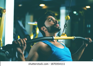 Indian Asian Handsome Man Working Out Or Exercising In The Gym - Health And Fitness Concept