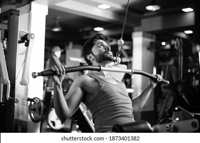 Indian Asian Handsome Man Working Out Or Exercising In The Gym - Health And Fitness Concept