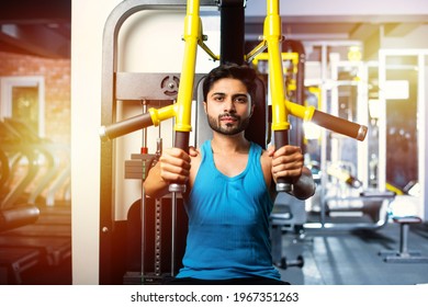 Indian Asian Handsome Man Working Out Or Exercising In The Gym - Health And Fitness Concept