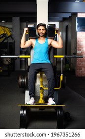 Indian Asian Handsome Man Working Out Or Exercising In The Gym - Health And Fitness Concept