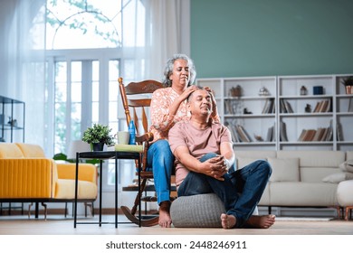 Indian asian Woman Giving Head Massage to husband using oil - Powered by Shutterstock