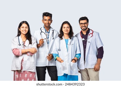 Indian asian young Team of doctor or medical professionals standing with arms crossed against white background - Powered by Shutterstock