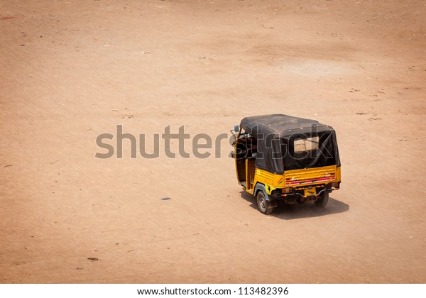 Indian auto\
(autorickshaw) in the street.\
India
