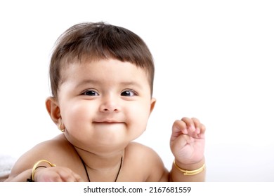 Indian Baby Girl Playing On White Background.