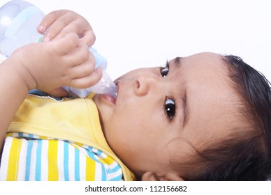 Indian Baby Laying Witn Baby Bottle