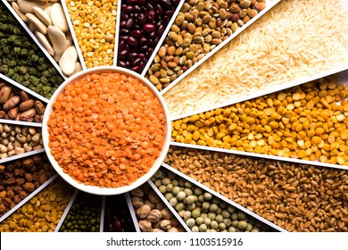Indian Beans,Pulses,Lentils,Rice and Wheat grain in a white Sunburst or sun rays shape designer container , selective focus.
 - Shutterstock ID 1103515916