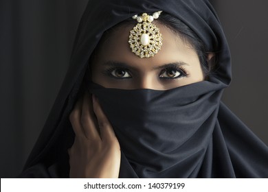 Indian Beautiful Muslim Girl Portrait Showing Her Eyes Only.