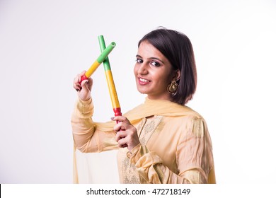 Indian Beautiful Young Girl With Garba Sticks Or Dandiya On Indian Festival Navratri, Isolated On White Background