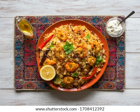 Indian Biryani with shrimp. Tasty and delicious prawns biryani, top view.