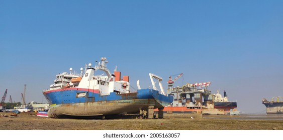 Indian Boats Cating In Alang, Boats On Beach In Sky Blue Background.