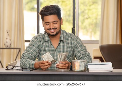 Indian Boy Counting Money He Saved For Education