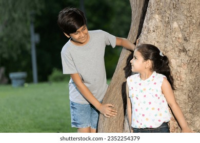 Indian boy and girl playing and fun in the park. happy indian family kid dream holiday concept. Asian Lifestyle theme concepts. - Powered by Shutterstock