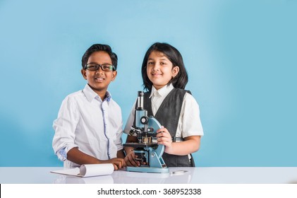 Indian Boy And Girl Withmicroscope, Asian Kids With Microscope, Cute Little Kids Holding Microscope, 10 Year Old Indian Boy And Girl And Science Experiment, School Students Doing Science Experiments