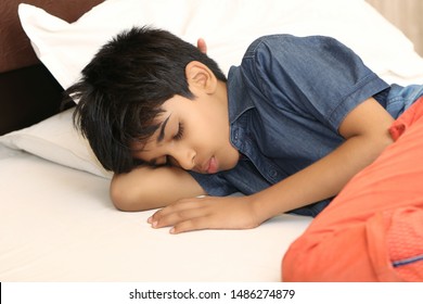 Indian Boy Sleeping In Bed At Home