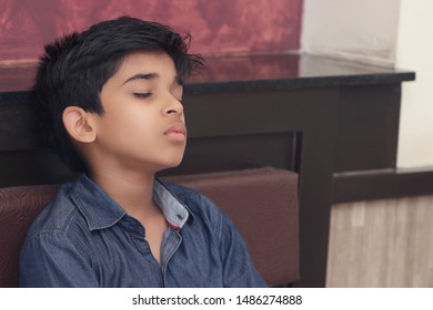 Indian Boy Sleeping In Bed At Home