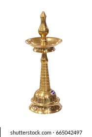 Indian brass oil lamp used for traditional festive and wedding occasions. Isolated south Indian oil lamp on white background.  - Shutterstock ID 665042497