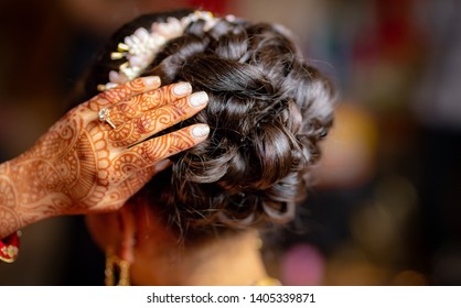 Indian Bridal Showing Er Hair Style And Mehndi Design