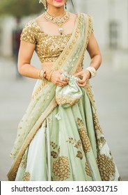 Indian Bridal Showing Wedding Lehenga Dress And Jewelry