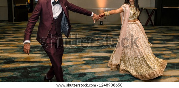 Indian Bride\
and groom dance on their wedding\
day.