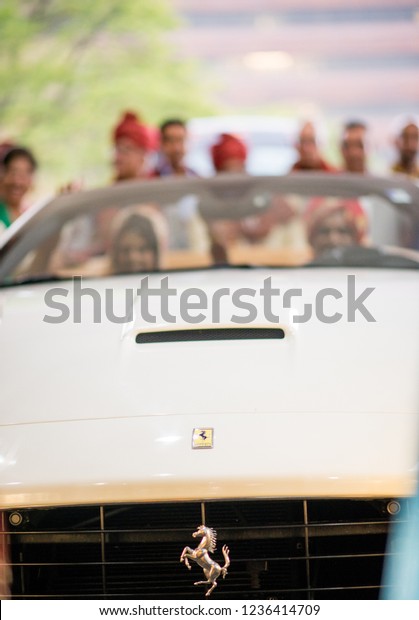 Indian bride and groom in Ferrari Car. Karachi,\
Pakistan - November 21,\
2018.