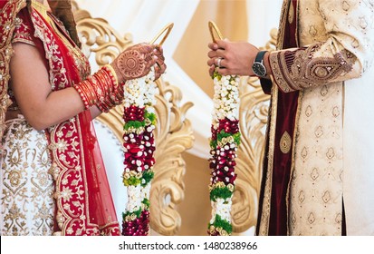 Indian bride and groom putting garland flower ritual ceremony
