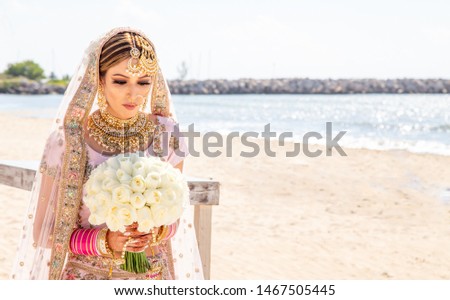 Indian bride preparing for her wedding ceremony with bright jewelry and detailed garments