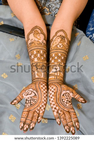 Indian bride shows her Henna Mehndi design.