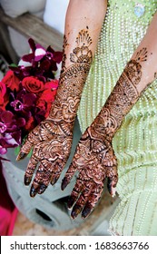 Indian bride's showing mehndi design.  mehndi hands. beautiful female hands with mehndi tattoos. Indian tradition.