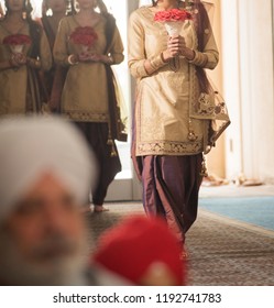 Indian Bridesmaids Walking In The Wedding Aisle Ceremony
Karachi, Pakistani October 01, 2018