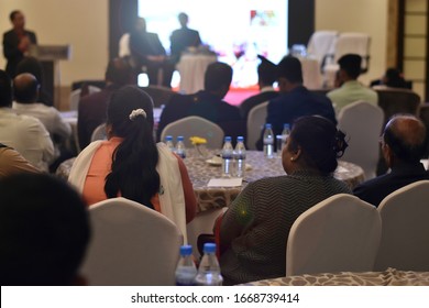 Indian Business And Entrepreneurship Concept. Audience At The Conference Hall In India. Speaker Giving A Talk At Business Meeting. Seminar, Webinar And Conference Hall Full Of Indian  Audiences.