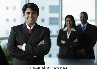 Indian Business Man Standing In Front Of Colleagues