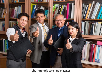 Indian Business People / Corporate culture and Working in the office and Teamwork Concept with Laptop, papers, meetings, Cel phones, presentations and discussions