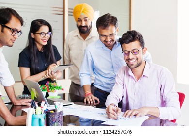 Indian Business Team Working Together In Office