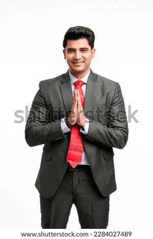 Indian businessman giving namaste or welcome gesture