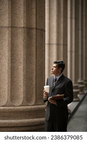Indian businessman. Professional Lawyer or business man outside a colonial courthouse building.  - Shutterstock ID 2386379085
