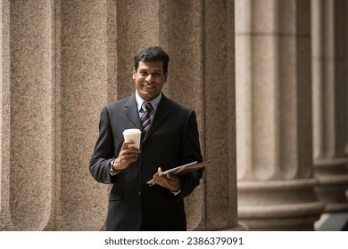 Indian businessman. Professional Lawyer or business man outside a colonial courthouse building.  - Shutterstock ID 2386379091