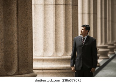 Indian businessman. Professional Lawyer or business man outside a colonial courthouse building.  - Shutterstock ID 2386379095