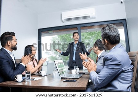 Indian businesspeople clapping and appreciating employee at conference, Praising for good work in company. Corporate job candidate presentation, Promotion. Our vision, Sales and growth. Marketing team