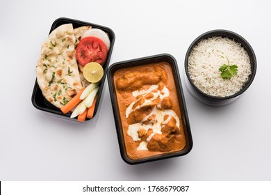 Indian Butter Chicken Curry Dish Served In Black Plastic Container For Food Delivery To Home