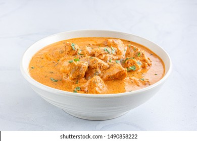 Indian Butter Chicken / Murgh Makhani in a Bowl on WHite Background Close Up Photo. - Shutterstock ID 1490858222