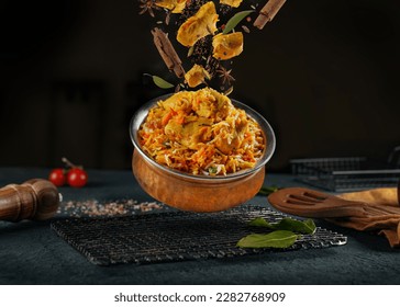 indian chicken biryani, Spicy chicken biryani food photography, flying food, black background.