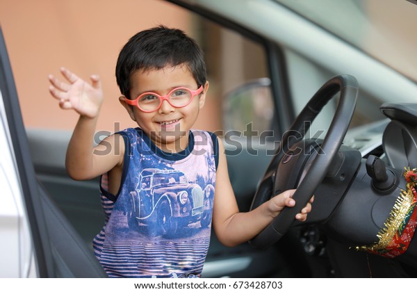 Indian child in\
car