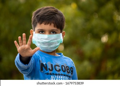 Indian Child With Mask Showing Five Fingers For Do The Five Tips Protecting From Corona Virus